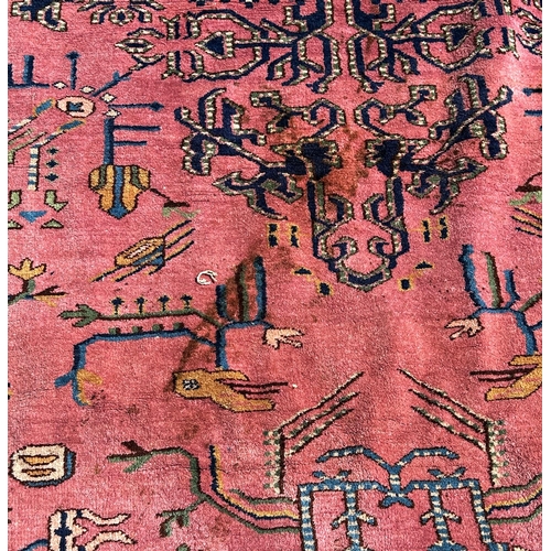 1600 - A large country house Malayer design carpet with a stylised floral centre with further stylised flow... 