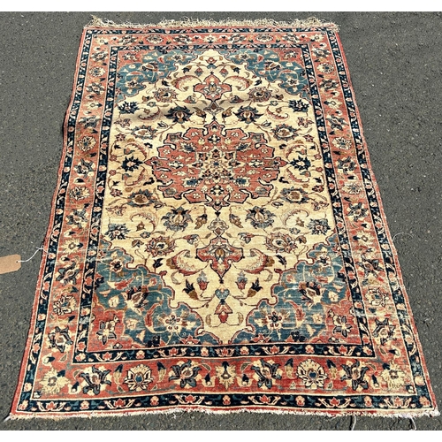 1605 - An old Bidjar type carpet, slightly faded and worn with a floral central medallion and an all over f... 