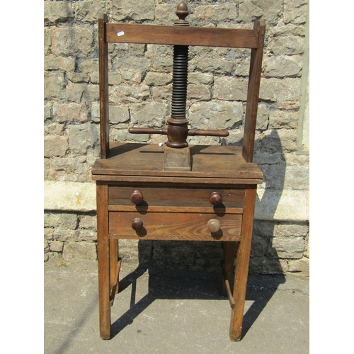 2746 - A 19th century ashwood household linen press with central screw thread over two drawers, 67cm