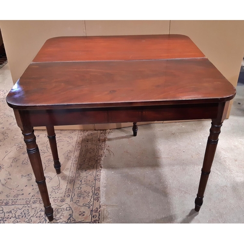 2182 - An early 19th century mahogany fold over top tea table raised on ring turned and tapered supports 90... 