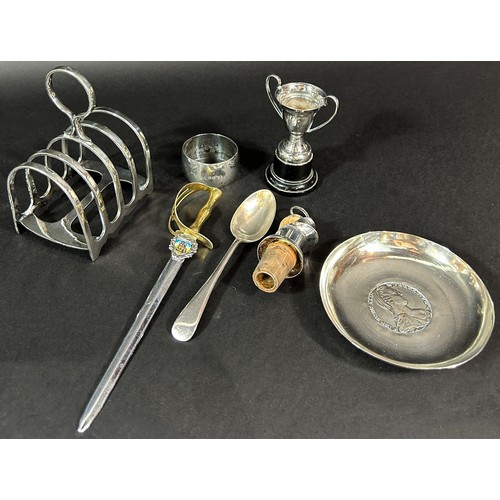 1185 - A silver plated tureen with cover, a toast rack , a bottle stop/pourer, a small trophy, a dish with ... 