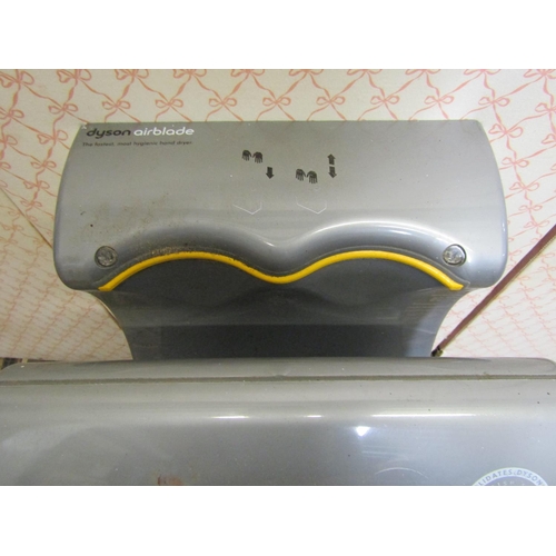 2155 - A Dyson Air Blade wall mounted hand dryer