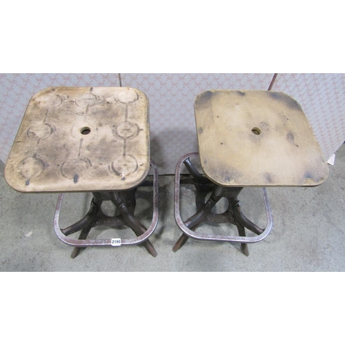 2199 - A pair of industrial stool or seat frames set on four splayed supports