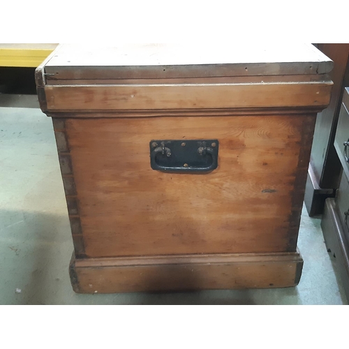 2196 - A large 19th century stripped pine blanket chest with iron carrying handles, 95cm long