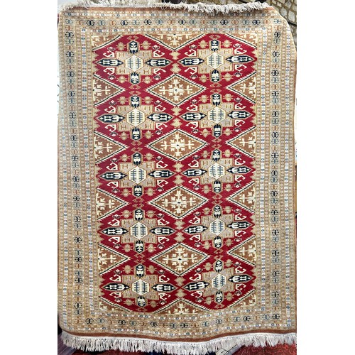 1594 - A Bokhara rug, West Turkestan, the madder field with lozenge and cruciform guls, 178cm x 129cm.