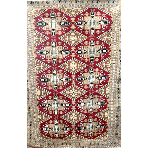 1594 - A Bokhara rug, West Turkestan, the madder field with lozenge and cruciform guls, 178cm x 129cm.