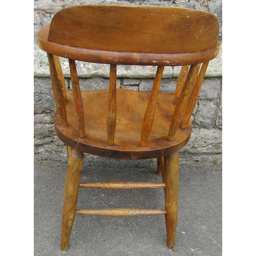 2185 - A Windsor style smokers elbow chair, principally in ash