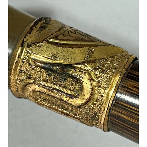 1522 - A Vintage black silk umbrella with a carved horn handle and an 18ct gold collar.