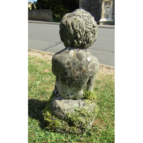 2117 - A small weathered cast composition stone garden water feature in the form of a seated cherub 38 cm h... 