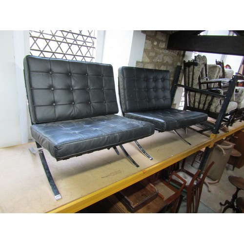 2200 - A pair of Barcelona style chairs, after Mies van der Rohe, chromium plated X frame with black button... 