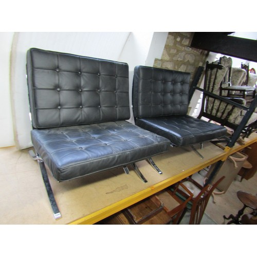 2200 - A pair of Barcelona style chairs, after Mies van der Rohe, chromium plated X frame with black button... 