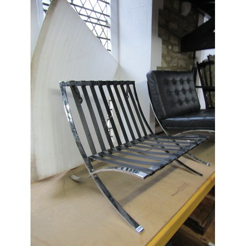 2200 - A pair of Barcelona style chairs, after Mies van der Rohe, chromium plated X frame with black button... 