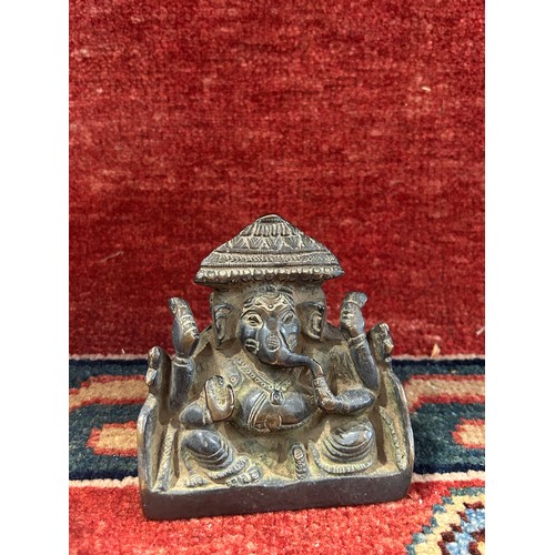 1530 - A Bronze figure of Ganesha 9cm wide x 9cm tall, and a Chinese blue and white vase, 20cm high.