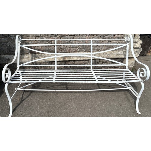 2053A - A heavy gage regency style strapwork garden bench with open scrolled arms. 185cm W