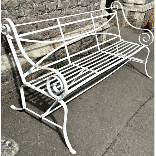 2053A - A heavy gage regency style strapwork garden bench with open scrolled arms. 185cm W