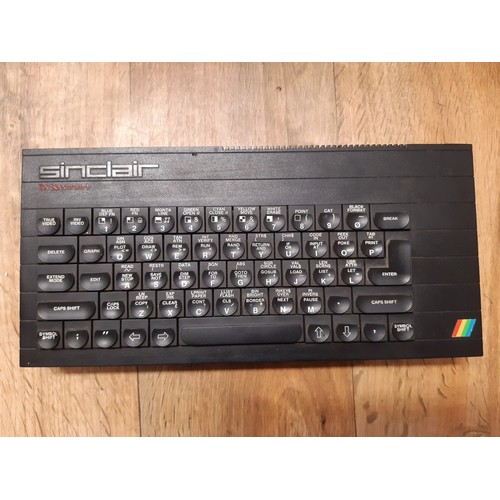 236 - Spectrum ZX personal computer, keyboard with handbook, 1983.  A quantity of Spectrum games, cassette... 