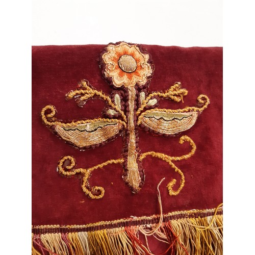 1579 - An ecclesiastic altar cover with crimson upper surface cloth and adjoining pink velvet fringed pelme... 