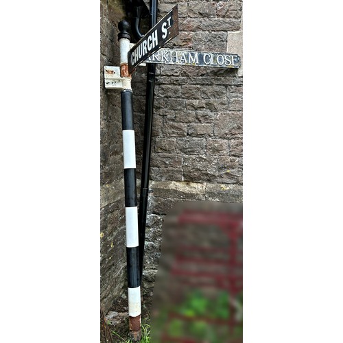 2081 - A vintage traditional painted cast metal fingerpost, with two directional signs in cast alloy and en... 