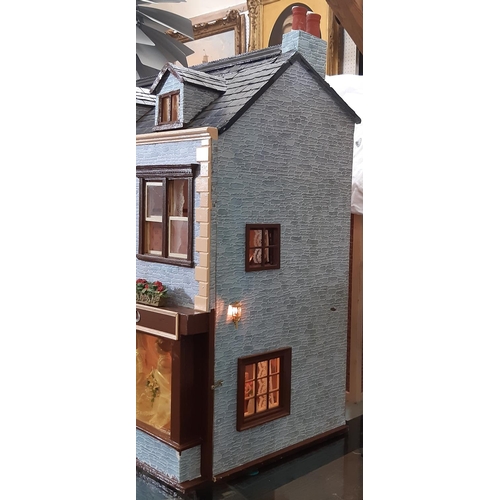 253 - 'Bridal Gowns etc'- an impressive and finely detailed period style dolls house shop comprising 3 sto... 