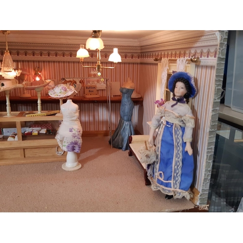 253 - 'Bridal Gowns etc'- an impressive and finely detailed period style dolls house shop comprising 3 sto... 