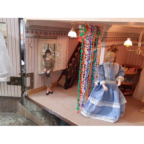 253 - 'Bridal Gowns etc'- an impressive and finely detailed period style dolls house shop comprising 3 sto... 