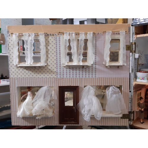 253 - 'Bridal Gowns etc'- an impressive and finely detailed period style dolls house shop comprising 3 sto... 