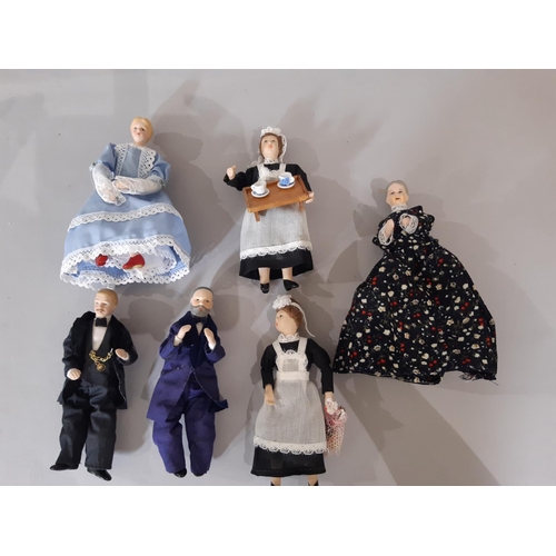 256 - A collection of 30 dolls house period character figures including ladies, gentlemen, staff, a police... 