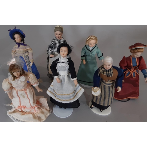 256 - A collection of 30 dolls house period character figures including ladies, gentlemen, staff, a police... 