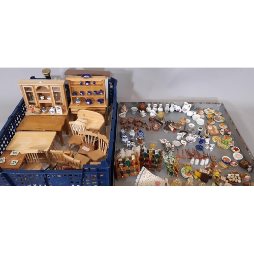 258 - A large collection of dolls house furnishings comprising kitchen related furniture, foods and utensi... 