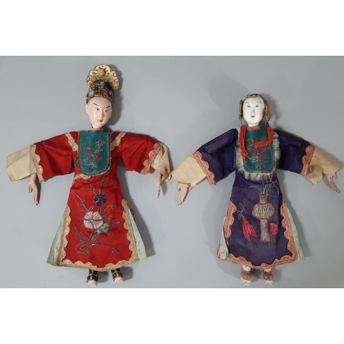 280 - Two early 20th century Chinese 'Opera' dolls, with long puppet-style hands, wearing traditional embr... 