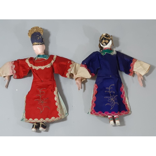 280 - Two early 20th century Chinese 'Opera' dolls, with long puppet-style hands, wearing traditional embr... 