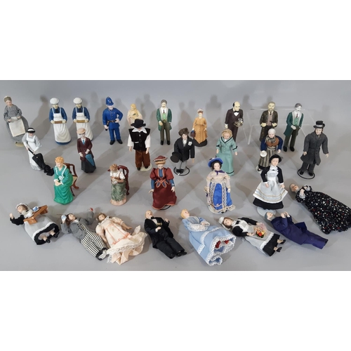 256 - A collection of 30 dolls house period character figures including ladies, gentlemen, staff, a police... 