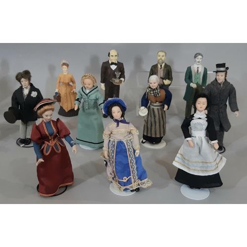 256 - A collection of 30 dolls house period character figures including ladies, gentlemen, staff, a police... 