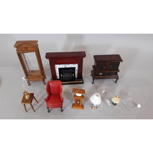 257 - A collection of dolls house dining room / living room furnishings including tables, chairs, dressers... 