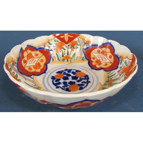 1074 - An Imari vase with panelled base and drawn neck, an Imari bowl and dish and a further Chinese export... 