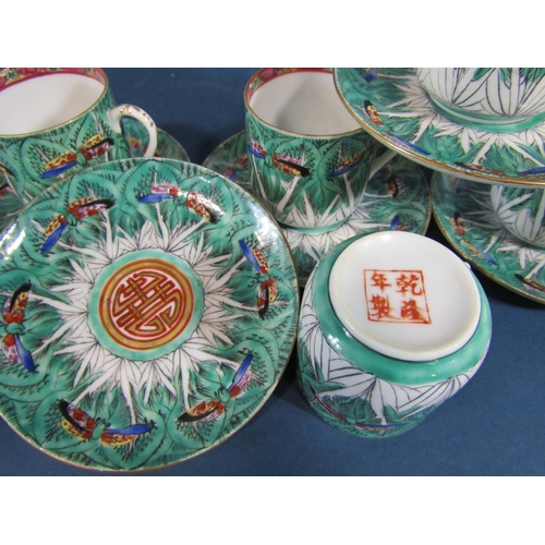 1076 - A Chinese butterfly pattern tea service for eight together with a famille rose mallet shaped vase wi... 