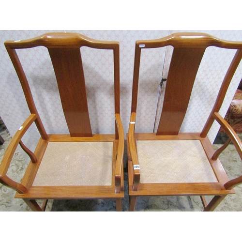 2176 - A pair of Chinese hardwood elbow chairs with shaped splats, woven seats, raised on square cut suppor... 