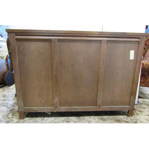 2184 - Oak side cupboard with open centre flanked by two leaded light doors, 123cm wide