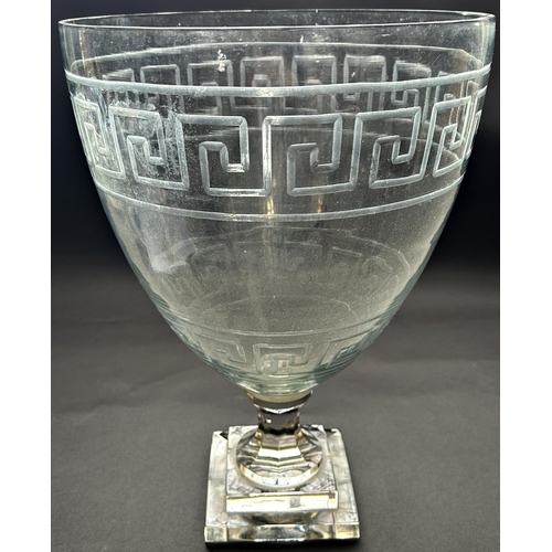 1173 - A very large glass 19th century vase with engraved Greek key bands, with a fluted stem and a stepped... 