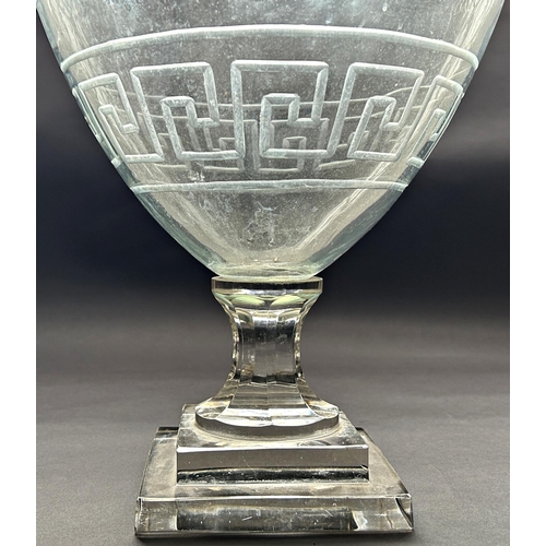 1173 - A very large glass 19th century vase with engraved Greek key bands, with a fluted stem and a stepped... 