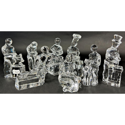 1177 - Eight glass figurines of artisans at work, a chef, a glass blower, a blacksmith, etc, a glass dolphi... 