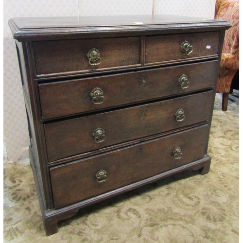 2210 - An old English countrymade chest of three long and two short drawers in mixed woods, raised on brack... 