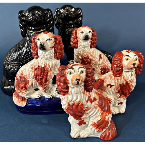 1089 - A pair of 19th century Staffordshire spaniels with rust coloured panels, further pair of spaniels an... 