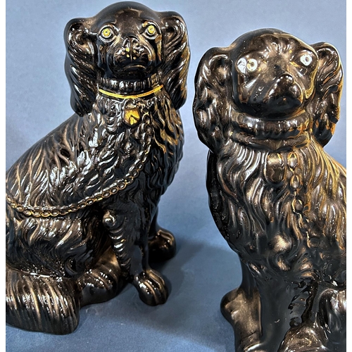 1089 - A pair of 19th century Staffordshire spaniels with rust coloured panels, further pair of spaniels an... 