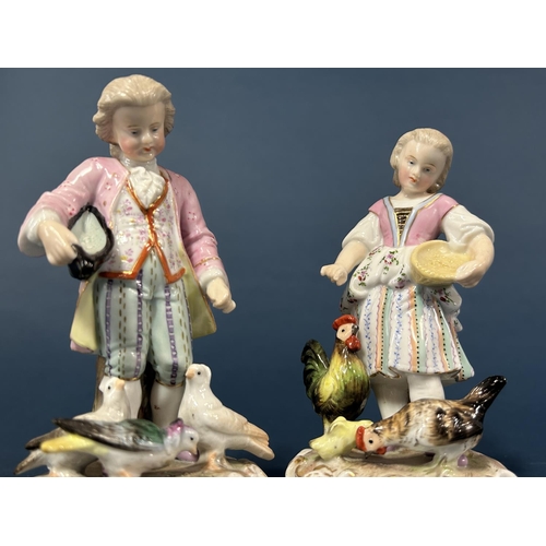 1094 - A pair of 19th century German figures, male and female characters feeding doves and chickens by Erne... 