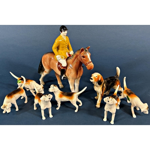 1095 - A collection of Beswick (mainly hunting related effects) including 7 hounds, 3 foxes and a huntsman