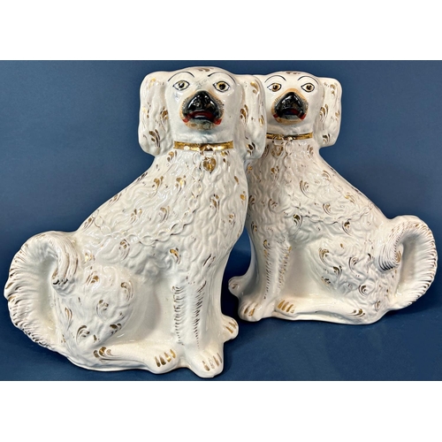 1105 - Two pairs of large 19th century white gilt Staffordshire spaniels