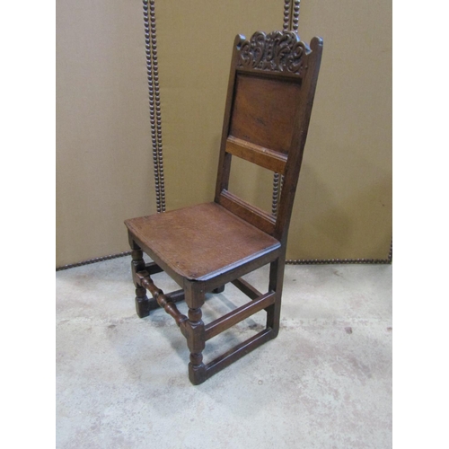 2242 - 18th century oak side chair with panelled seat and back, the back set beneath a carved cresting rail... 