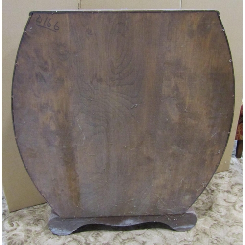 2302 - 1950s walnut veneered display cabinet, with shaped outline and glazed panelled sliding doors