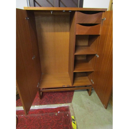 2312 - An E Gomme 'G' plan quadrill dwarf teak robe with partially fitted interior 91 cm wide x 46 cm deep ... 